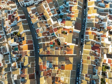 Streets and rooftops in the White Town of Olvera. Aerial view. Drone shot. Cádiz province,