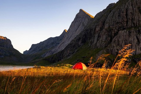 Red tent on the beach at Horseid, Lofoten, Norway, Europe