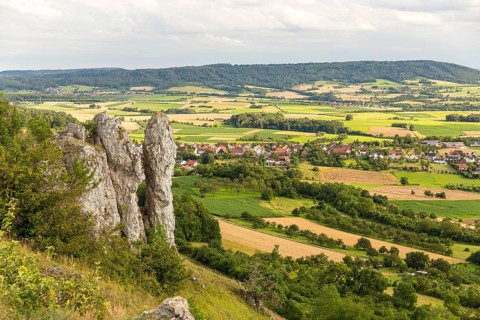 Wiesenthauer Nadel rock formation on the Walberla, view of Schlaifhausen, Ehrenbürg, Bavaria,