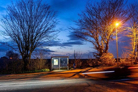 Bus stop Pierburg, in the evening, illuminated, Meisenburger Straße, Essen-Schuir, line 142, in the