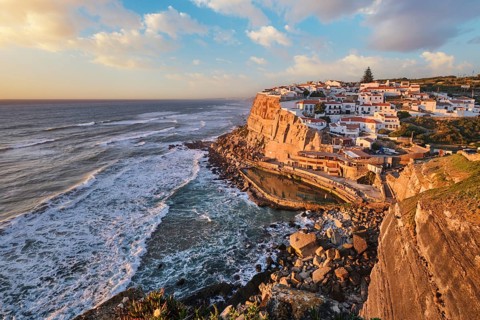 Scenic view of the seaside Azenhas do Mar fishing village on cliff on Atlantic ocean coast,