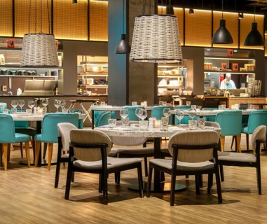 Tables and chairs set for diners in Gino D'acampo restaurant, Melia INNSiDE Liverpool hotel,