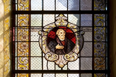 Stained glass window with Martin Luther in the Evangelical Lutheran Market Church of St Cosmas and