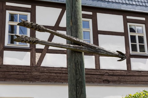 Large wooden arrow as a signpost in Mülsen, Zwickau district, Saxony, Germany, Europe