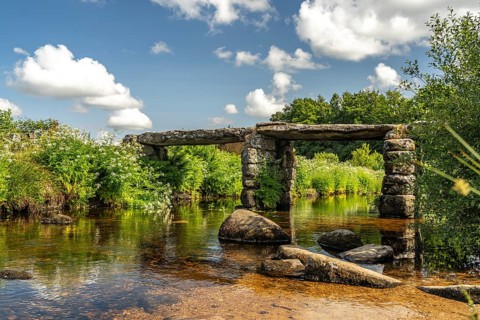 The medieval stone slab bridge Clapper Bridge in Postbridge, Dartmoor, Devon, England, Great