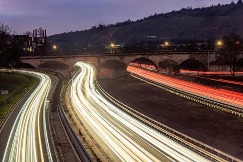 Multi-lane road at night with Plinsau bridge, arch bridge over the Neckar. Federal road B10 in