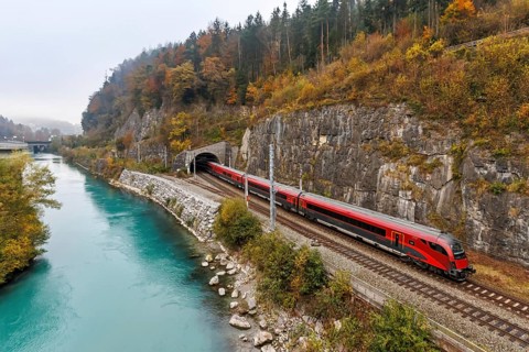 Railjet railway passenger train of the Austrian Federal Railways ÖBB on the Arlbergbahn in autumn