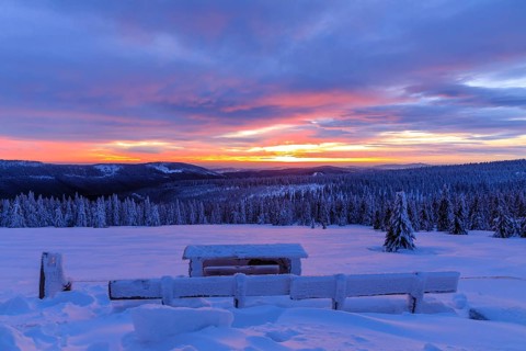 Colourful sunset in winter, view from the Wossecker Baude above Harrachsdorf in the Giant