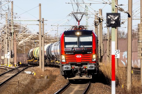 Goods train with Swiss locomotive passing through Baden-Baden station on the Rhine Valley line. SBB