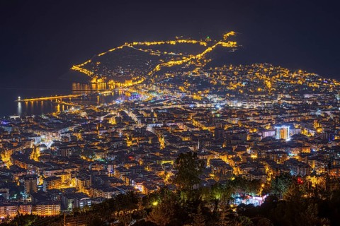 The lights of the city of Alanya on the Turkish Riviera glow in the evening, Alanya, Antalya,