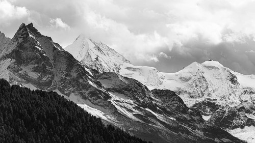 Snow-covered peaks of the mountains Le Besso and Obergabelhorn, black and white photo, Val