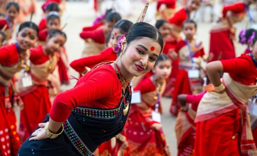 Participants with instructors dance on the final day of a Bihu dance workshop ahead of Rongali Bihu