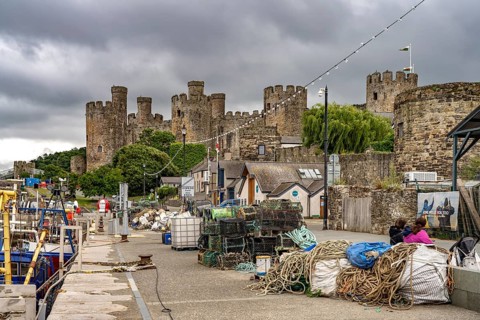 At the fishermen's quay and Conwy Castle in Conwy, Wales, Great Britain