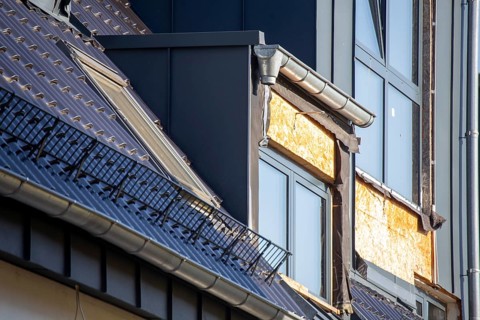 Extension of living space by installing a dormer window: Newly installed dormer window on a newly