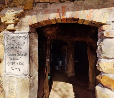 Sign at the entrance to the Schmidthöhle cave, Langenstein cave dwellings, district of Halberstadt,
