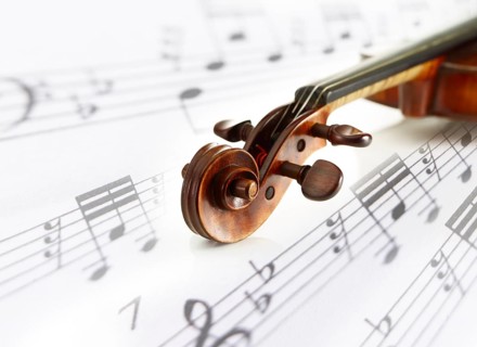 Detail view of a violin, sheet music, composing