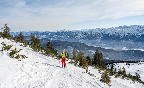 Ski tourers climbing Simetsberg, view of mountain panorama, Estergebirge, Bavarian Prealps, Bavaria