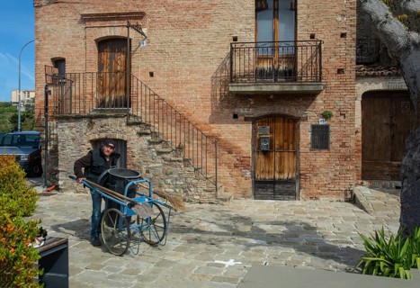 Garbage collectors in the square of Aliano, the very poor village in southern Italy that the writer