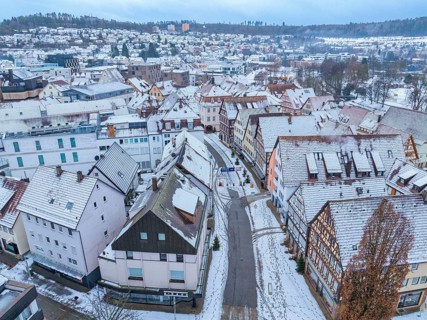 Bird's eye view of a snow-covered roofscape in a small town, Nagold, Black Forest, Germany, Europe