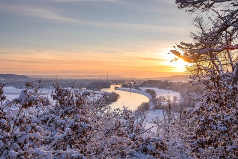 Sunrise at the Scharfenberg viewpoint on a winter morning, view of the Elbe valley as far as