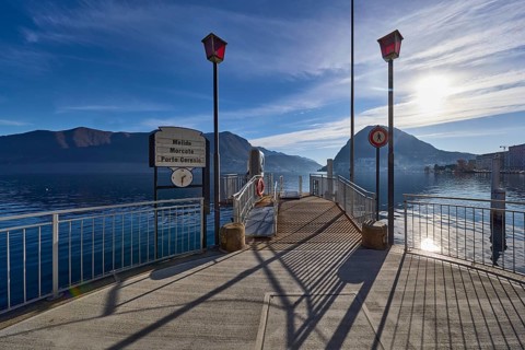 Ferry terminal Lugano-Centrale, public transport, jetty, lanterns, metal railings, backlight of the