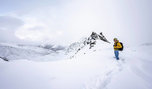 Ski tourers in a wintry mountain landscape in fresh snow, Ortler Alps, Vinschgau Valley, Italy,