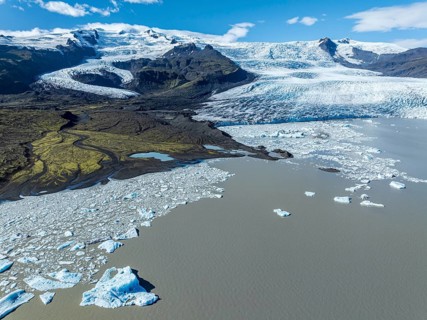 Aerial view over the glacial lake Fjallsárlón, glacier Fjallsjökull, part of Vatnajökull glacier,
