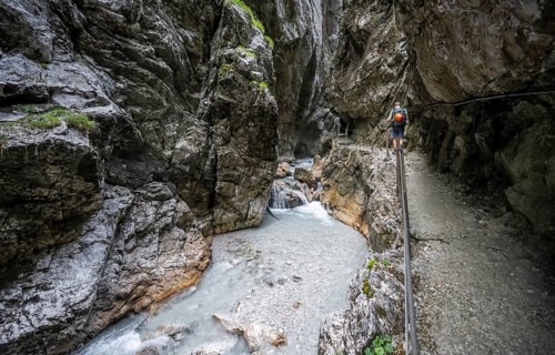 Hammersbach mountain stream in a canyon, mountaineer on a hiking trail in a gorge, Höllentalklamm,