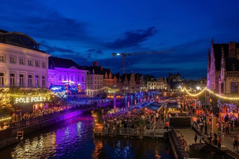 Visitors on grandstand at the Graslei watching Pole Pole podium during Gentse Feesten, Ghent city