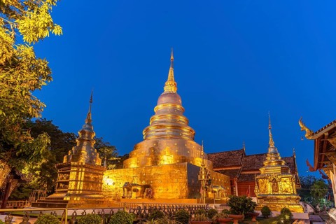 Golden Chedi Phrathatluang of the Buddhist temple complex Wat Phra Singh at dusk, Chiang Mai,
