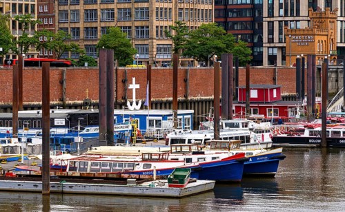 Ships, sailors and launches in Hamburg harbour at the Speicherstadt, Hamburg, Germany, Europe