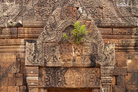 Relief with Shiva and Parvati on the bull Nandi above the false door of the mountain temple Wat