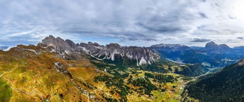 Dark clouds over the Geisler and Puez Group, wide-angle panoramic shot, drone shot, Val Gardena,