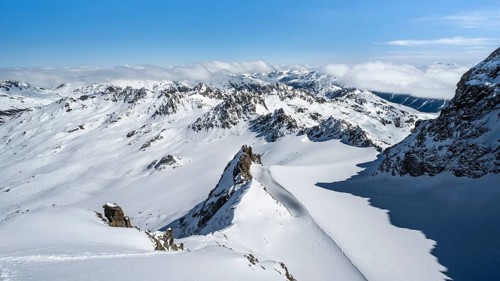 Mountain ridge of Piz Kesch, ascent on Piz Kesch or Piz d'Es-cha in winter, spectacular mountain