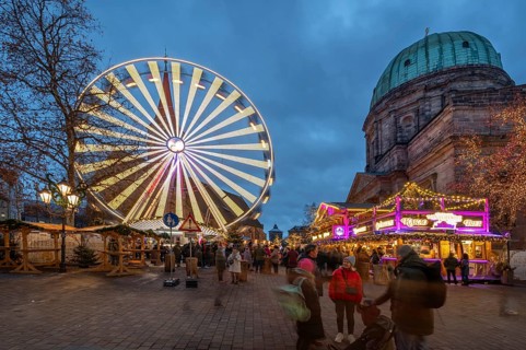 The winter village with Ferris wheel, Christmas market on Jakobsplatz to the right of St
