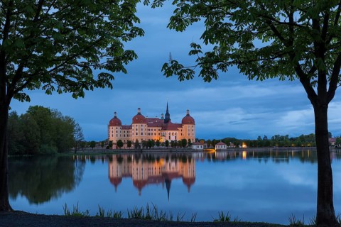 Moritzburg Hunting Lodge with reflection in the castle pond in the evening, Moritzburg, Saxony,