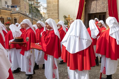 Confraternity of penitents gathering outside San Leonardo church, Enna, Siclly, Italy, Europe