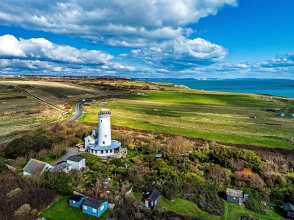 Portland Bird Observatory from a drone, Bill Lighthouse, Portland Bill, Isle of Portland, Dorset,