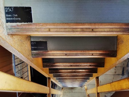 Staircase to climb the church tower with nameplates on each step as fundraising, Evangelical