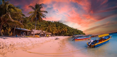 Tela, Honduras, January 2020: Local transport boats at Cocalito beach in Punta de Sal on the