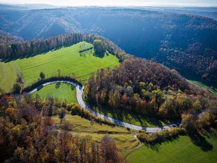 Country road near Lenningen with winding road, landscape on the Swabian Alb in autumn. Aerial view