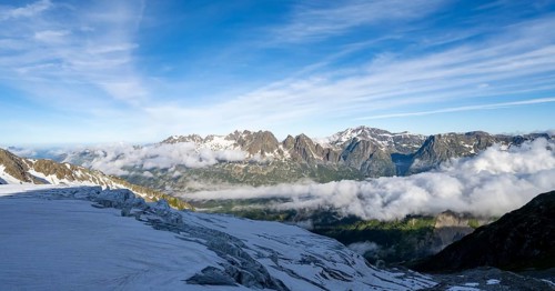 View of mountain peaks and the valley of Chamonix with high fog, Chamonix, Haute-Savoie, France,