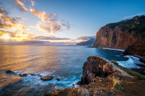 View of Madeira scenic cliffs coastline landscape on sunrise, Guindaste viewpoint, Madeira island,