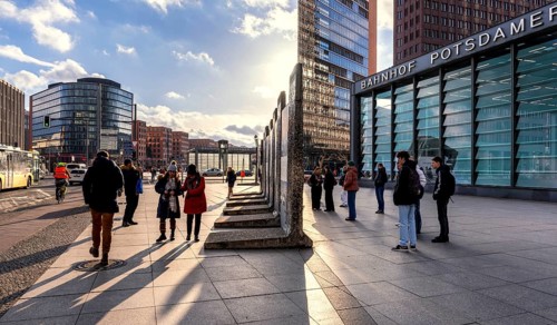 Tourists in front of the Wall segment at Potsdamer Platz, Berlin, Germany, Europe