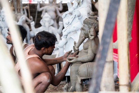 Artisan work on idols of the elephant-headed Hindu deity Ganesha at a workshop ahead of the Ganesh
