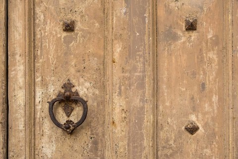 Door knocker on an old wooden gate, Galatina, Apulia, Italy, Europe