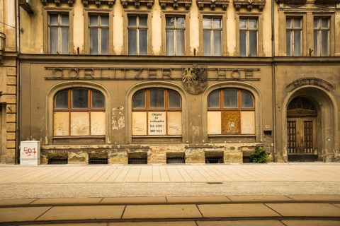 Facade of an old closed hotel, Goerlitzer Hof, in need of renovation, GDR architecture, city
