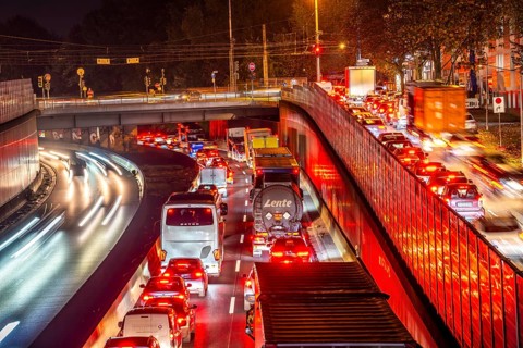 Evening traffic, partly with congestion, slow-moving traffic on the A40 motorway, traffic jam