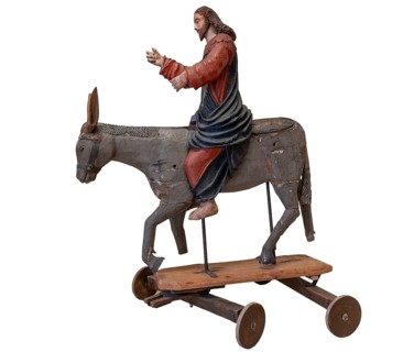 Christ on the palm donkey, on a white background, wooden figure from around 1400, Museum Bezau,