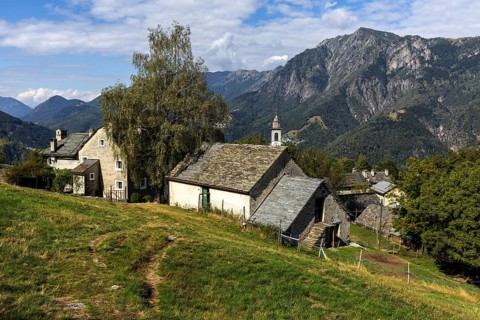 View of the village, typical Ticino stone houses in the mountain village of Rasa, Centovalli,